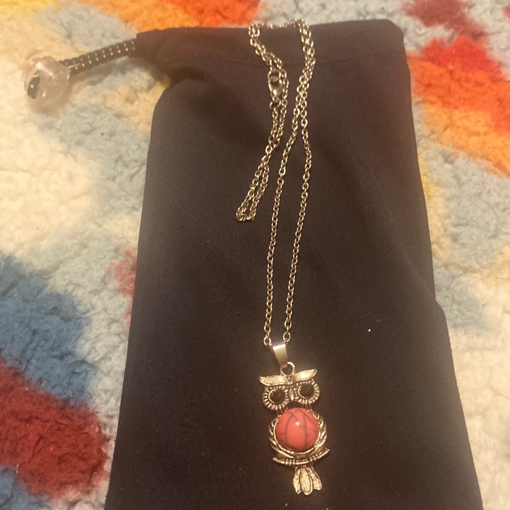 Necklace with owl charm, with pink belly silver.